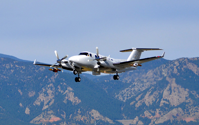 An aircraft equipped with SPEC instruments flying in the air as part of research services
